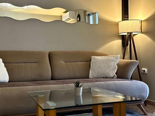 a living room with a couch and a table at Spin Inn in Kotor