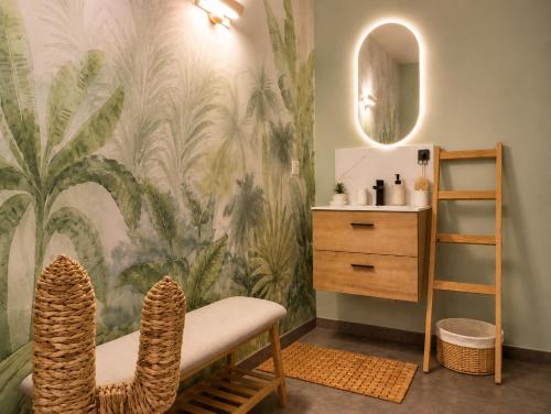 a bathroom with a mural of plants on the wall at ROOMS HOME CSM Suites privees élégantes entre Reims et Disneyland Paris 1 à 8 personnes in Charly-sur-Marne