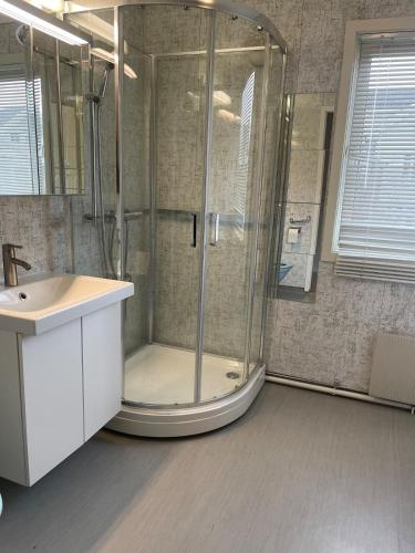 a bathroom with a shower and a sink at Best place to live in Trondheim