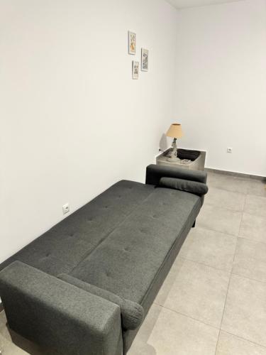 a bedroom with a large bed and a table at Hera in Verga Kalamata