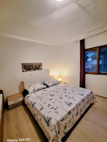 a bedroom with a large bed in a room at Vacation Home Katarina in Nin