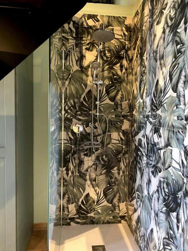 a wall with a mural of plants on it at Loft Open Space, Capoliveri Centralissimo in Capoliveri
