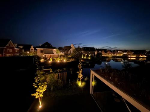 a view of a town at night with lights at Waterfront in Alkmaar