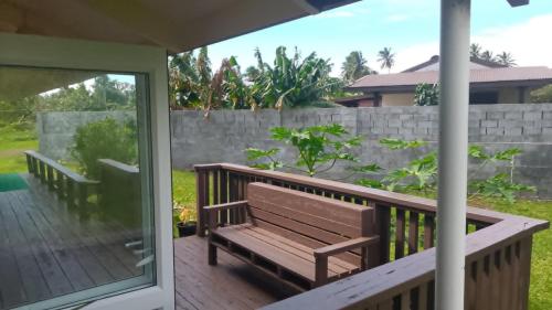a porch with a bench on a deck at Hidden Haven - Group Retreat-Sleeps 7 aircon & free Wifi in Rarotonga