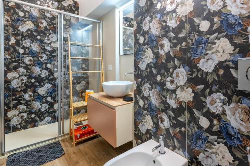 a bathroom with a shower and a sink at Deiana's House in Alghero