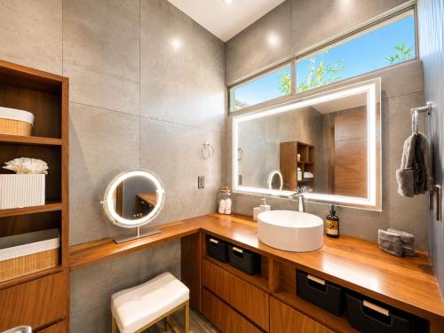 a bathroom with a sink and a mirror at Casa Vista 133 in Cabo San Lucas