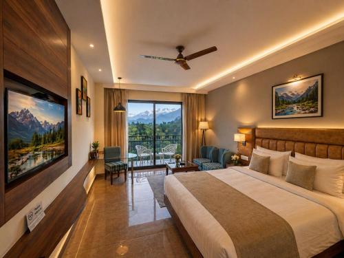 a hotel room with a bed and a large window at Aachman Riviera Valley dharamshala by NAINA STAYCATION in Dharmsāla