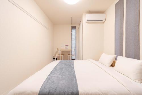 Lova arba lovos apgyvendinimo įstaigoje Atsuta Good Place Hotel