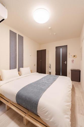 Lova arba lovos apgyvendinimo įstaigoje Atsuta Good Place Hotel