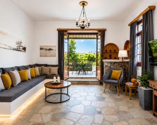 a living room with a couch and a table at Efcharis house Skopelos in Neo Klima