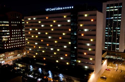 a view of a building at night with lights at VIP Grand Lisboa Hotel & Spa in Lisbon