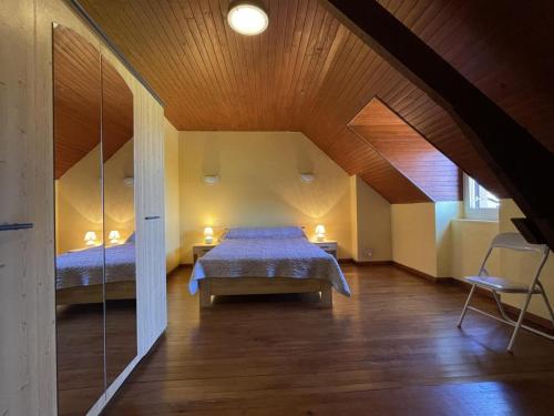 a bedroom with two beds in a attic at Chez bourdet-pelou in Arette