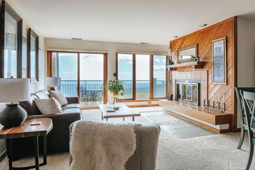 a living room with a couch and a fireplace at Panoramic Peak in Mount Torry Furnace