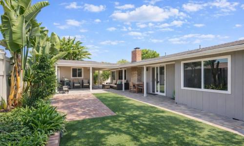a home with a yard with green grass at Disneyland Dream Villa 5 BR 3 BA Arcade Games in Anaheim