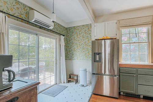 a kitchen with a stainless steel refrigerator and a balcony at The Woodward in Staunton