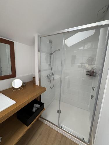 a shower stall in a bathroom with a sink at Samui - Equipé borne de recharge - Powering Station Electric Car in Capbreton