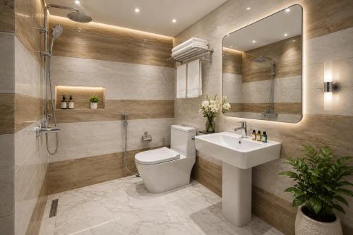 a bathroom with a toilet and a sink and a mirror at Taj View By Signature Stayz in Agra