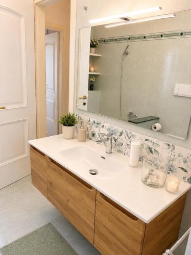 a bathroom with a sink and a mirror at Lo Zio Vito in Porto San Giorgio
