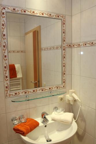 a bathroom with a sink and a mirror at Haflingerhof in Fiss