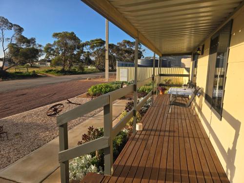 a porch of a house with a bench on it at Wudinna Crow's Nest in Wudinna