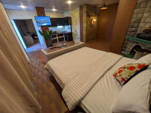 a hotel room with two beds and a bathroom at Acacia Homes in Kuldanna