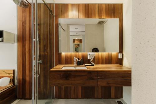 a bathroom with a sink and a mirror at TTR Rin Villa & Hotel in Da Lat