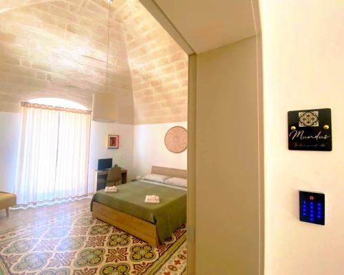 a bedroom with a bed in a room at Somnium Vitae - Casa Vacanze in Montescaglioso
