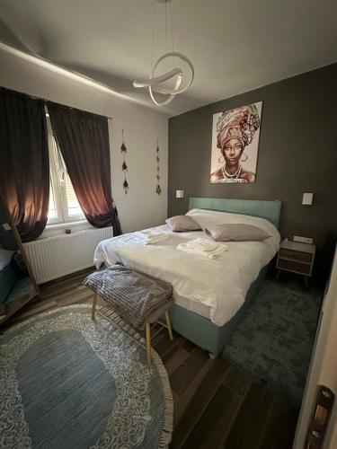 a bedroom with a large bed and a rug at Mimis House in Tsotílion