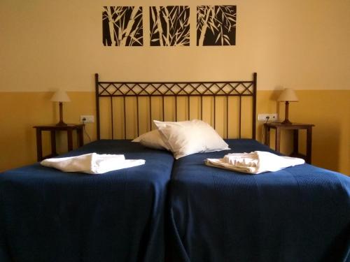 Katil atau katil-katil dalam bilik di Hotel Rural Terrablanca