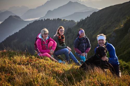 a group of people sitting on top of a mountain at Der Gollinger in Saalbach Hinterglemm