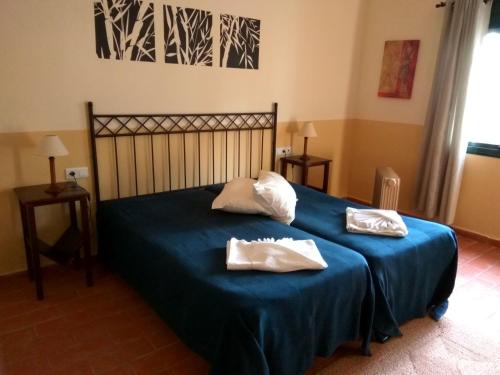 Katil atau katil-katil dalam bilik di Hotel Rural Terrablanca