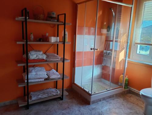 a bathroom with a shower and a glass shower stall at Casa Adelina in Foz