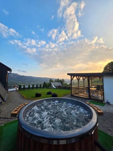 a hot tub in a yard with a gazebo at A Dream Colibita in Colibiţa