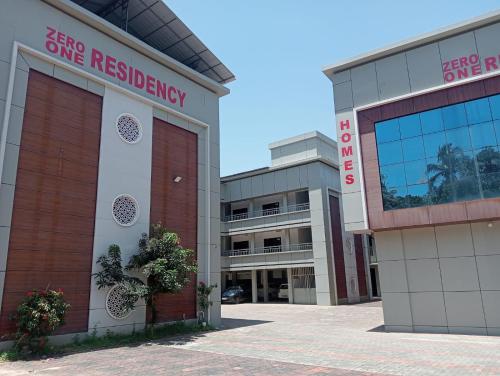 a building with a sign that reads stay one residency at Zero One Residency in Quilāndi