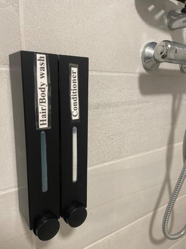 a black box on a wall with a toothbrush at Mickeys Shed in Waterford