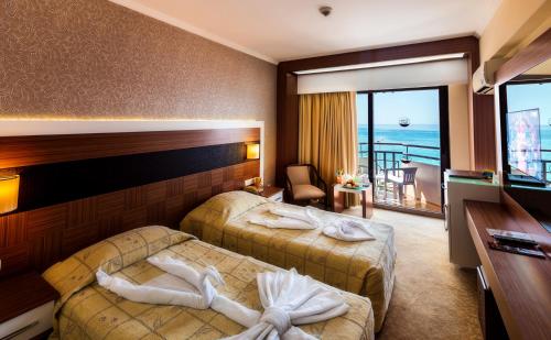 Postel nebo postele na pokoji v ubytování Derici Hotel