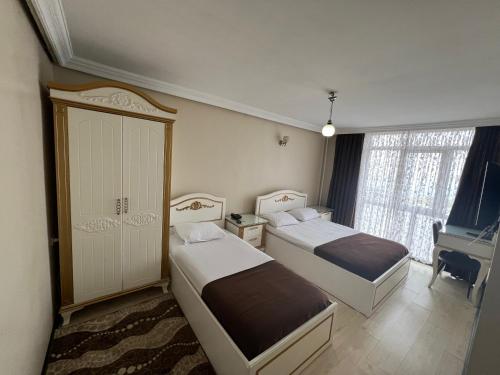 Postelja oz. postelje v sobi nastanitve Şeref Hotel