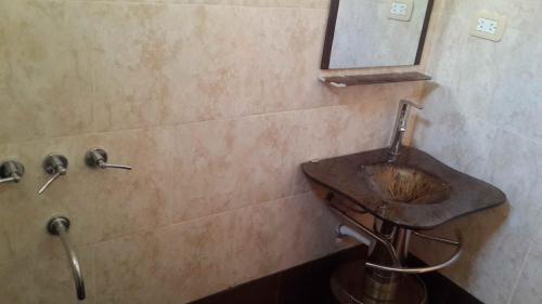 a bathroom with a sink and a mirror at Kaizen in Mendoza