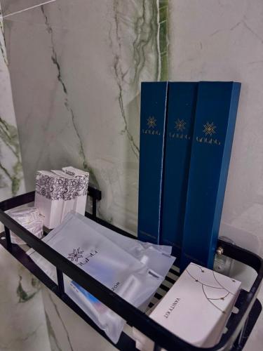 a cart filled with gifts and blue books at Davos Hotel in Pʼarakʼar