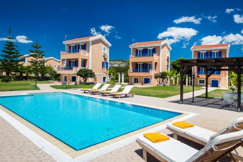 a villa with a swimming pool in a resort at Villas Cape in Minia