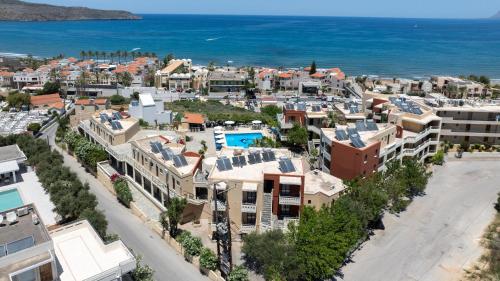 an aerial view of a city with buildings and the ocean at Ekavi Apartments in Agia Marina Nea Kydonias