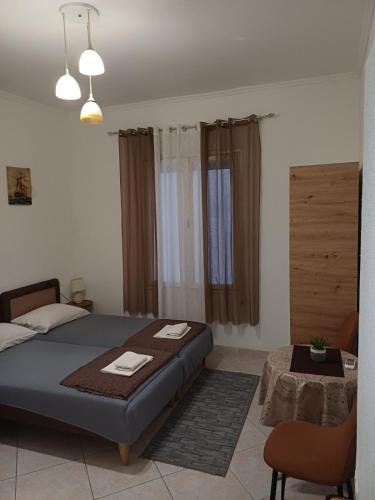 a bedroom with a bed and a table in it at Studio Rada in Ulcinj