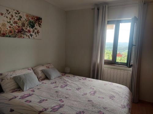 a bedroom with a bed and a window at Apartment Fabris in Roč