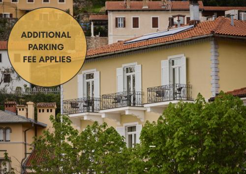 a building with a sign that reads additional parking fee appraisers at Hotel Villa Schubert in Opatija