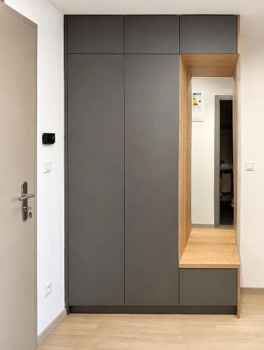 a door in a room with a mirror at Harmony Metropolis Bratislava Free Parking in Nivy