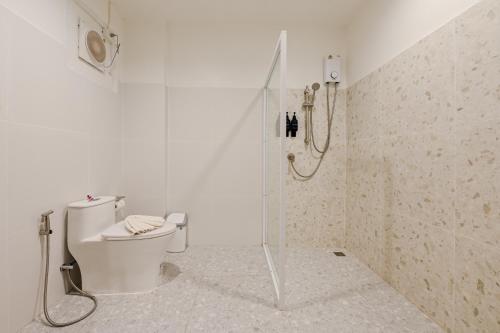 a bathroom with a shower and a toilet in it at Little Home Ao Nang in Ao Nang Beach