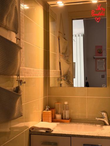 a bathroom with a sink and a mirror at La casa di E in Sesto Fiorentino