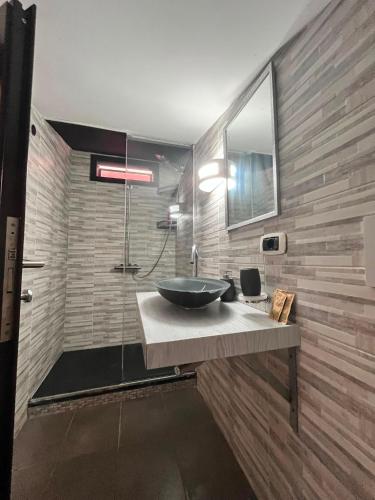 a bathroom with a sink and a mirror at Solaris Guest House in Ciampino