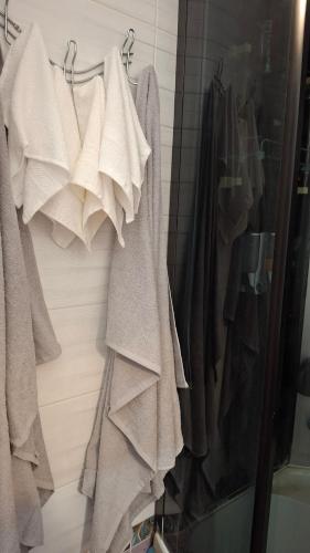 a rack of clothes hanging on a wall at See4YOU in Odesa
