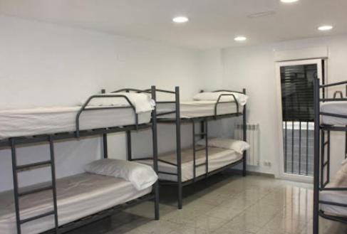 a group of bunk beds in a room at Albergue Izar in Viana